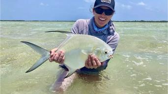 A large fish in a woman's hands